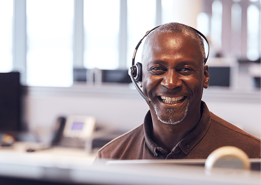 Smiling person wearing headphones
