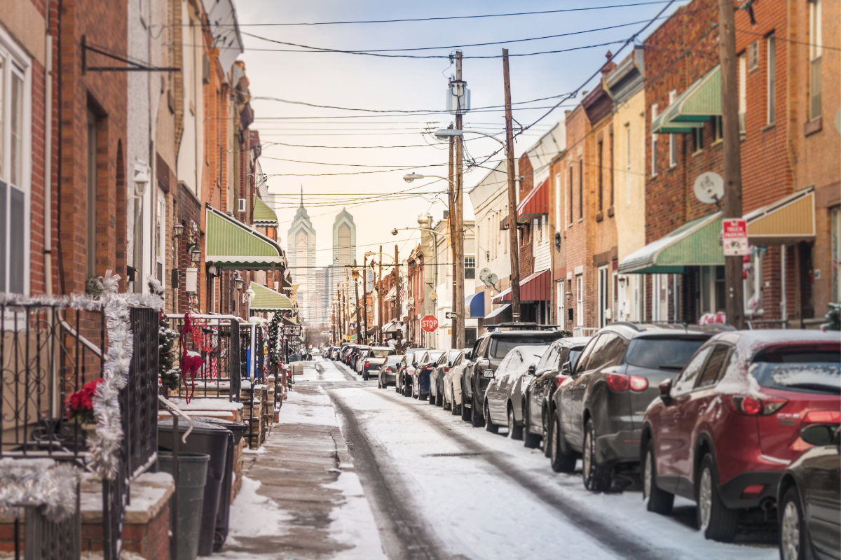 Picture of street with snow on it in the city of Philadelphia