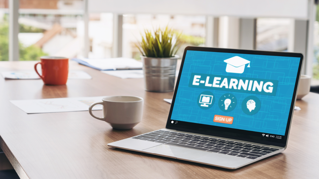 image of a computer on a desk with the words learning on screen