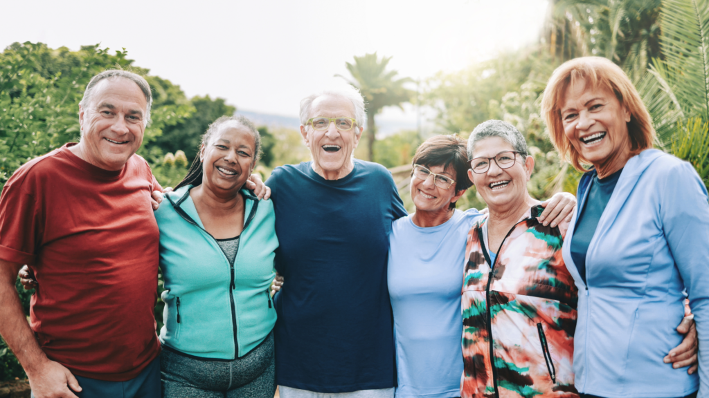 Group of older latino adults smiling and posing for camera