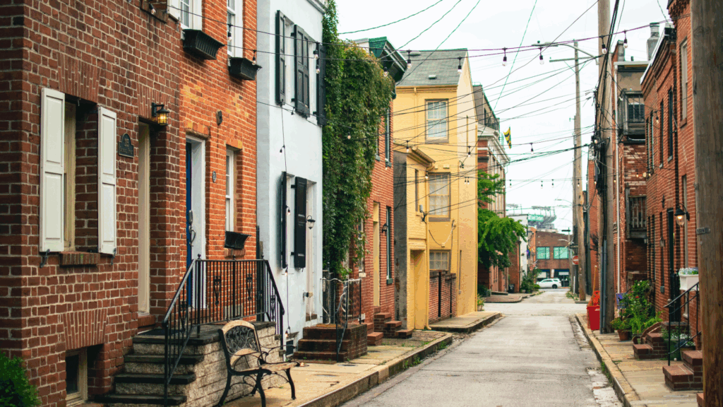 Image of a small street with row home houses.