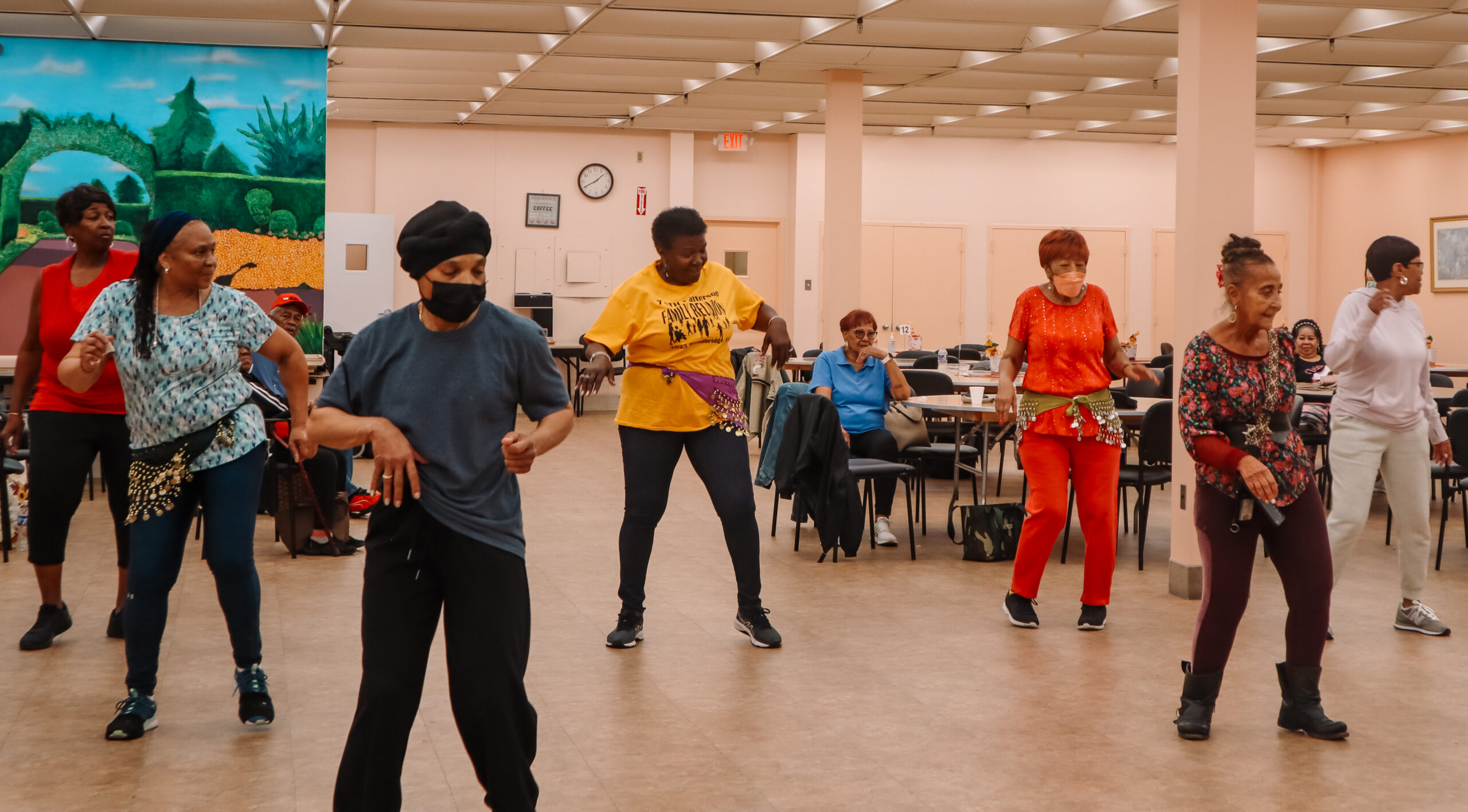 Older adults standing during an exercise class.