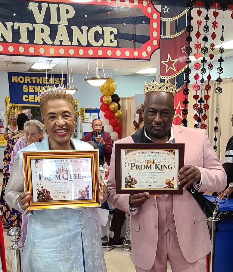 Photo of the prom king and prom queen under a VIP entrance sign